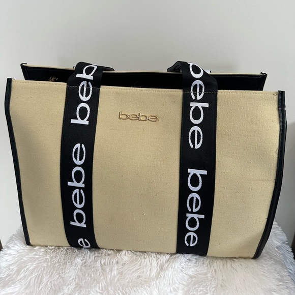 bebe Handbags - Bebe Beige Tote with Black Logo Straps NWT
